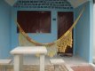 Varanda dos chalés com a rede de descanso e lazer e mesa para jogar ou conversar fora dele. :: Pousada Chalés do Mar - Foto 17 Varanda dos chalés com a rede de descanso e lazer e mesa para jogar ou conversar fora dele. :: Pousada Chalés do Mar - Foto 17