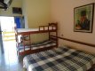Vista da cama da casal,beliche, TV ar condicionado evaranda :: Pousada Solar das Flores - Foto 10 Vista da cama da casal,beliche, TV ar condicionado evaranda :: Pousada Solar das Flores - Foto 10