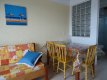 Detalhe de apartamento. Mesa para refeições e sofá . :: Pousada Maria Nicolau - Foto 7 Detalhe de apartamento. Mesa para refeições e sofá . :: Pousada Maria Nicolau - Foto 7