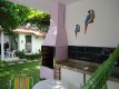 Área externa de uma Casa , com churrasqueira, pia e balcão e rede,voltada para o pátio interno e arborizado . :: Pousada Maria Nicolau - Foto 9 Área externa de uma Casa , com churrasqueira, pia e balcão e rede,voltada para o pátio interno e arborizado . :: Pousada Maria Nicolau - Foto 9