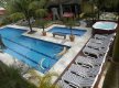 Foto do deck c/ espreguiçadeiras e piscinas :: Pousada Acqua Ville - Foto 7 Foto do deck c/ espreguiçadeiras e piscinas :: Pousada Acqua Ville - Foto 7