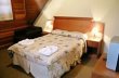 Suite do 2* andar,quase toda de madeira estilo chale,piso de carpete frigobar,tv e aquecedor- casal :: Pousada Campos do Jordão - Foto 2 Suite do 2* andar,quase toda de madeira estilo chale,piso de carpete frigobar,tv e aquecedor- casal :: Pousada Campos do Jordão - Foto 2